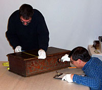 Andy and Doug examine an object at the Iroquois Storage Facility