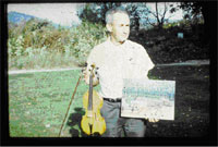 William McBurnett with painting and violin