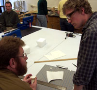John Emery discusses proper mounting techniques with Perry Price during a workshop presented by Chris Rossi for the Professional Seminar series