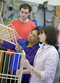 Gretchen, Ryan, and Valerie in the exhibit lab